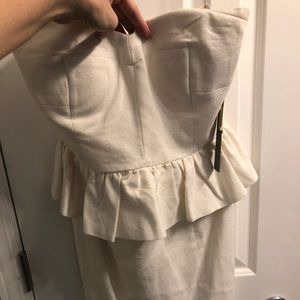 Strapless dress with peplum detail